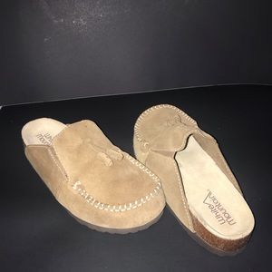 Tan colored slippers